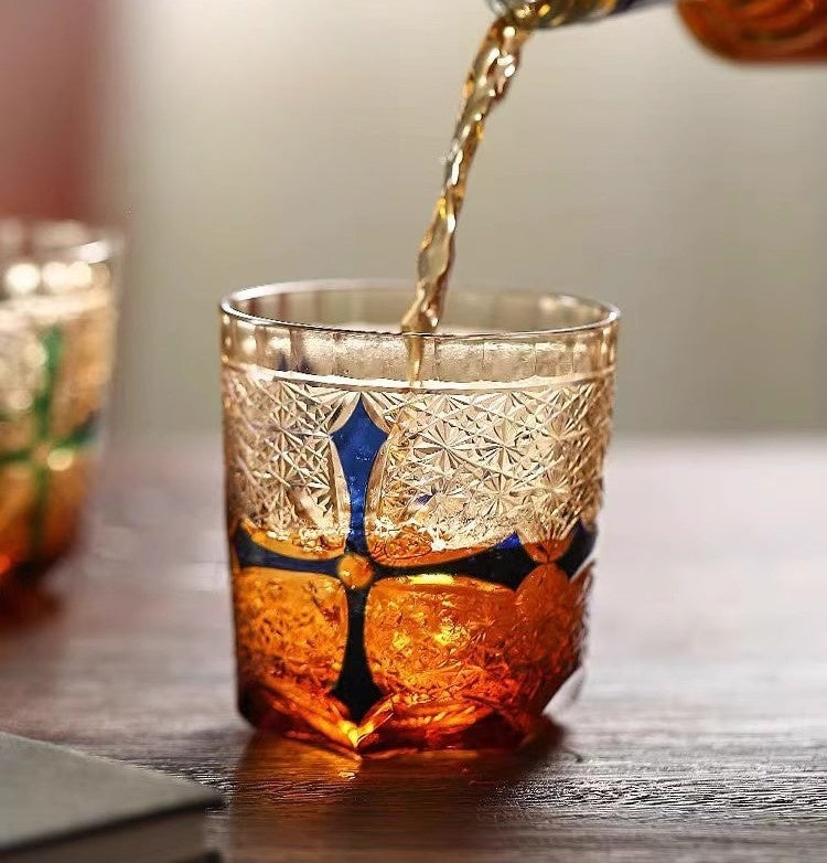 Crafted Light: The Edo Kiriko Amber Whisky Glass with Chromatic Cross Heart Elegance